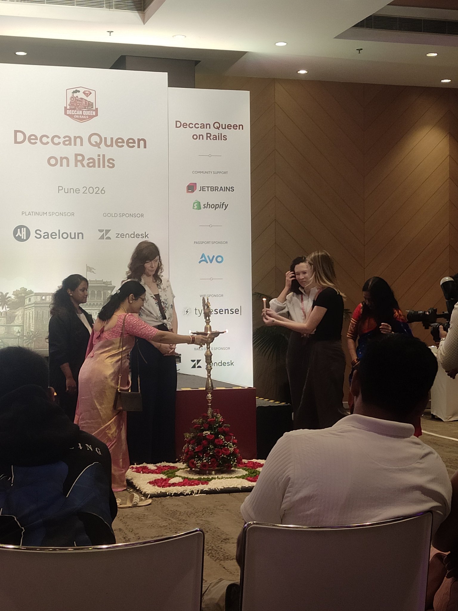 Women lighting the ceremonial diya at the opening of Deccan Queen on Rails in Pune